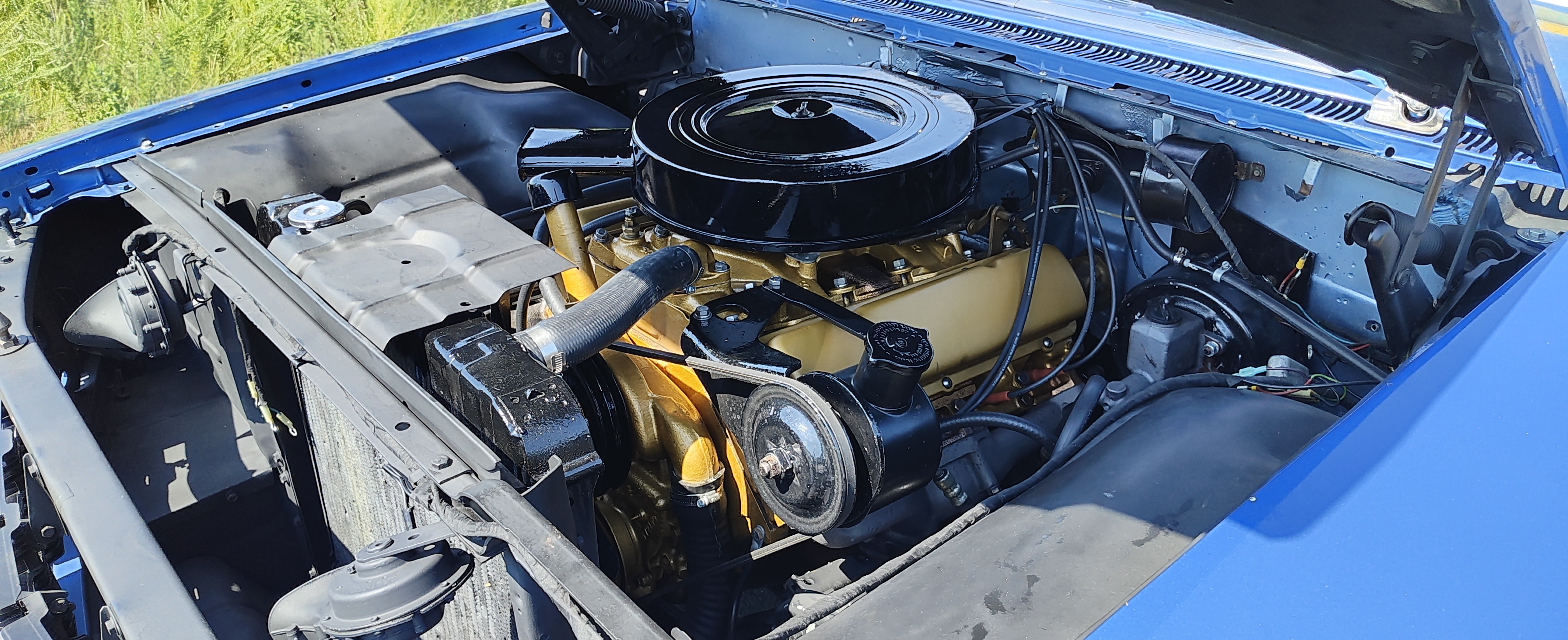 Engine bay of the Oldsmobile