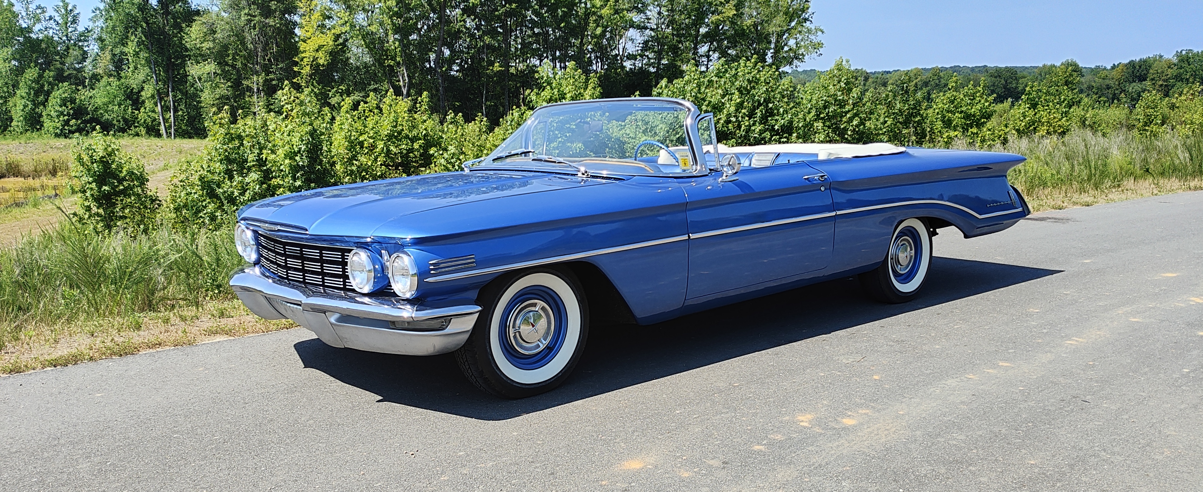 Blue 1960 Oldsmobile Dynamic 88 Convertible viewed from the front left